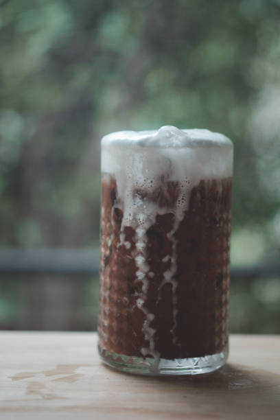 istock Ice coffee with cream in a tall glass. Selective focus. 1253666345