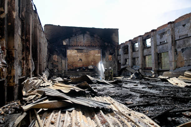 istock Burned house interior after fire, ruined building room inside, disaster or war aftermath 1253666634