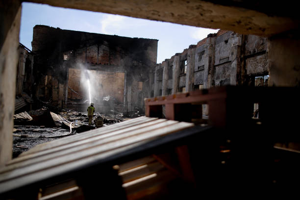 istock Burned house interior after fire, ruined building room inside, disaster or war aftermath 1253666665