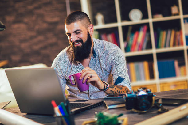 istock Young man working on his laptop computer at home 1253666769