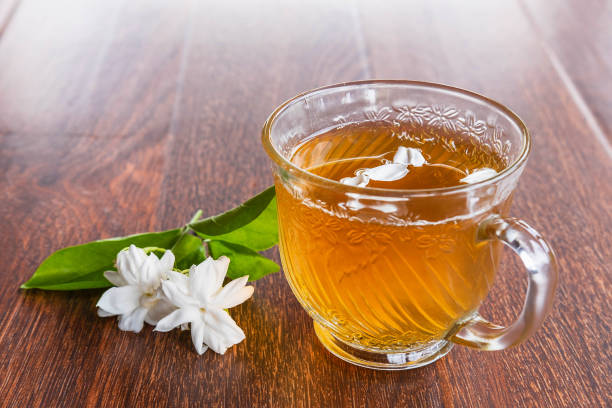 A cup of tea and flowers on the table