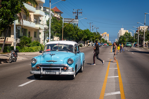 Vintage cars on the streets of the El Vedado neighborhood in Havana, Cuba in February 2018.
