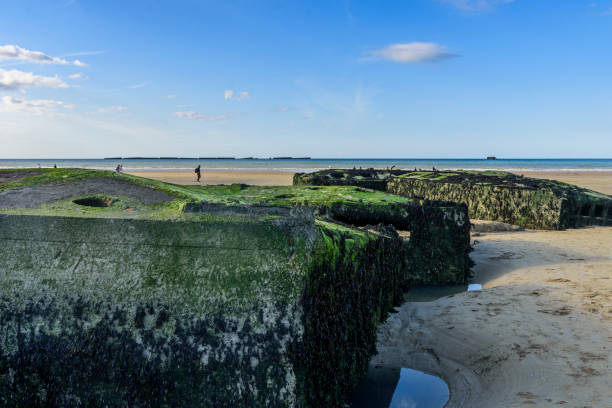 View of the surroundings on a sunny day, with remains of the platforms used in the Normandy landing.