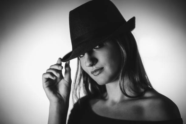 istock Beautiful elegant woman with hat 1253674922