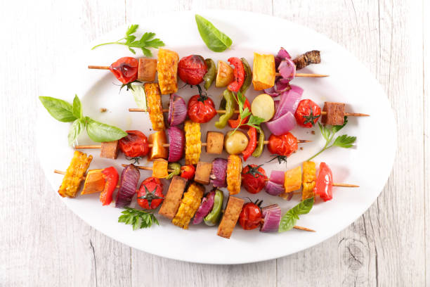 istock vegetable skewer barbecue with corn, tomato, bell pepper, onion and basil 1253675052