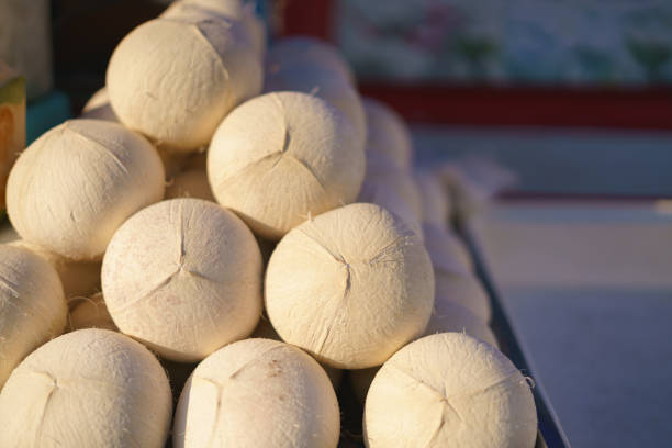 Roasted or grilled coconut for drink at the street market stall in Thailand