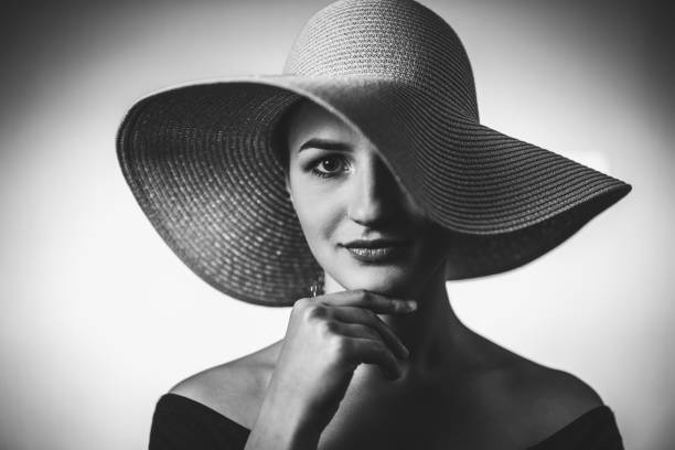 istock Beautiful elegant woman with oversized hat 1253675188