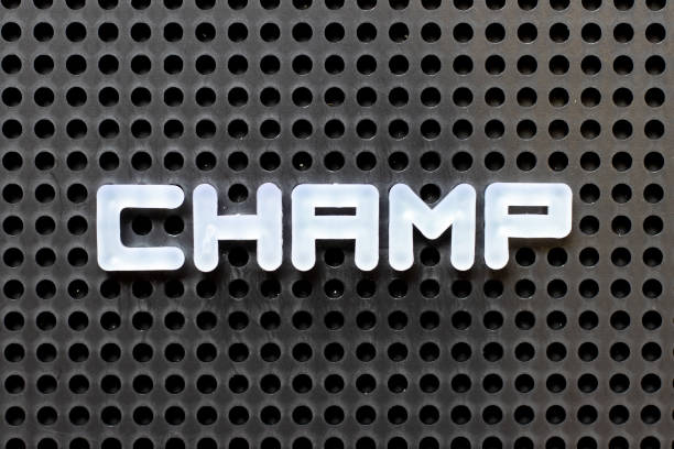 istock White color alphabet with word champ on black pegboard background 1253676932