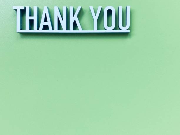 istock Thank you phrase on green background 1253677660