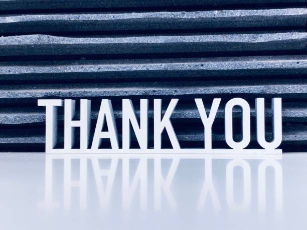 istock Thank you phrase on dark background 1253677685