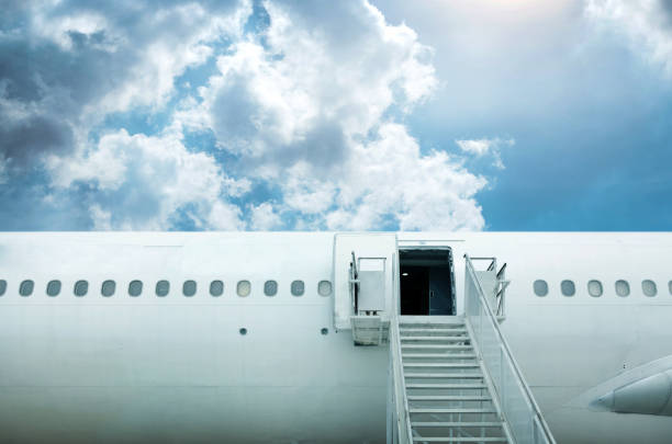 istock open door and stairstep from airplane 1253678142