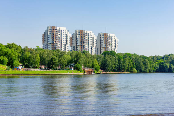 istock Landscape with a walk along the river embankment. 1253678916