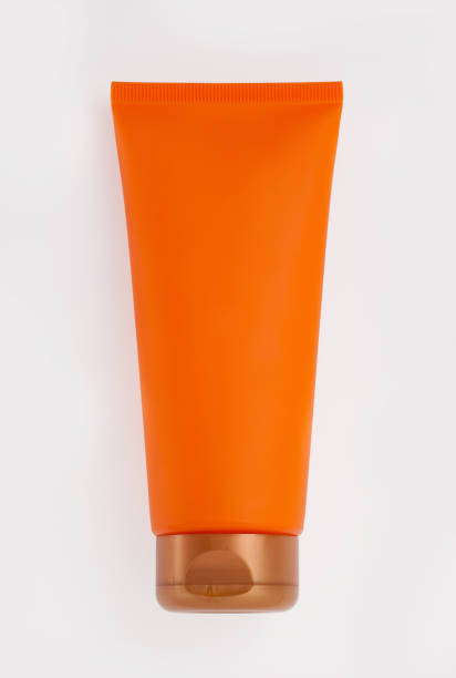 istock Orange Plastic Tube for beauty product 1253680296