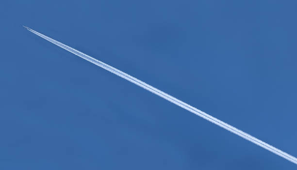 istock white trail of an airplane on the blue sky 1253680519