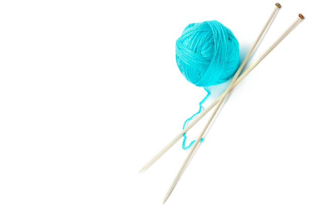 istock Ball of woolen thread and knitting needles isolated on white background. 1253680874