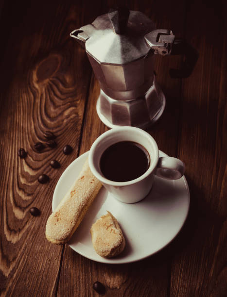 istock Italian Moka Pot coffee maker pot with coffee cup 1253681670