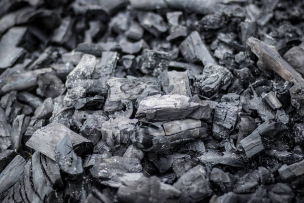 istock Black charcoal texture background. Close-up. Charcoal is a folk wisdom. 1253681977