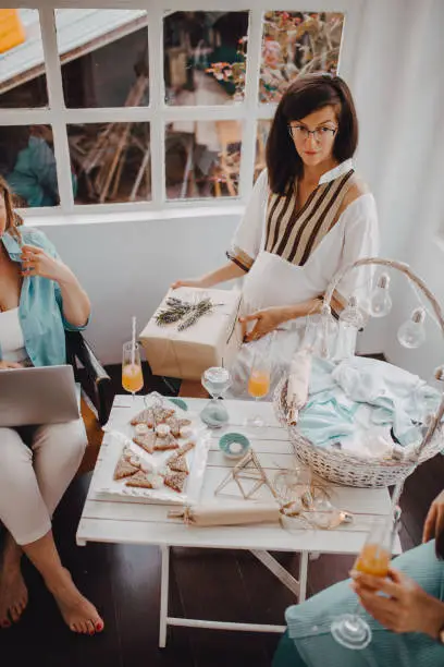 Photo of Pregnant woman with her female friends