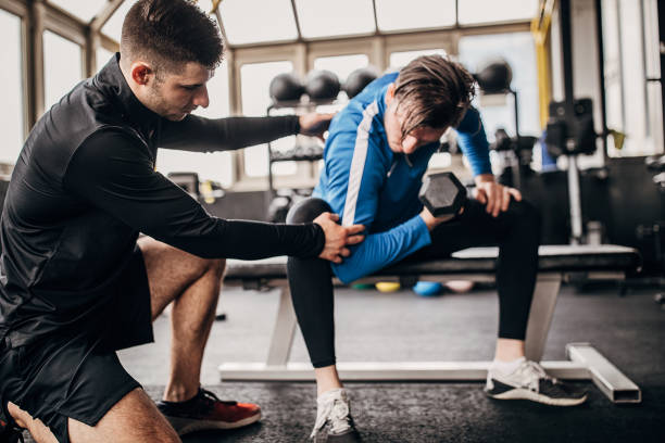 istock Personal training in the gym 1253683570