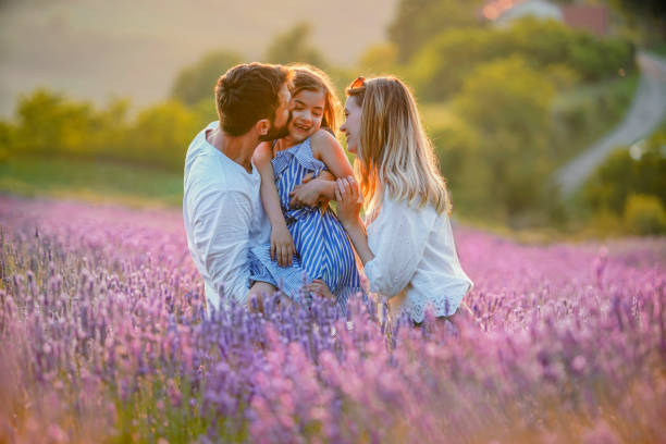 istock Happy family in lavender field 1253683601