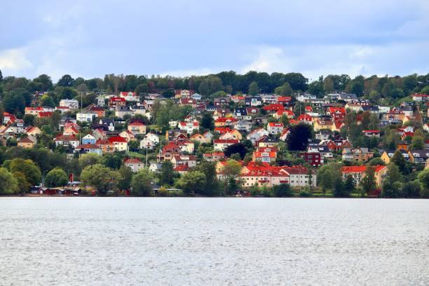 Swedish residential architecture Swedish residential architecture. Lakeside colorful homes by lake Vattern in Jonkoping, Sweden. jonkoping stock pictures, royalty-free photos & images