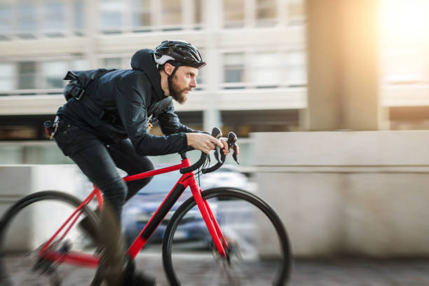 istock Bicycle messenger: commuter with road bicycle in the city 1253684841