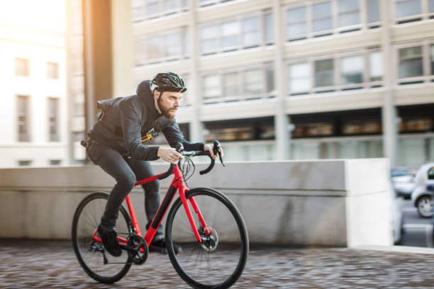 istock Bicycle messenger: commuter with road bicycle in the city 1253684846