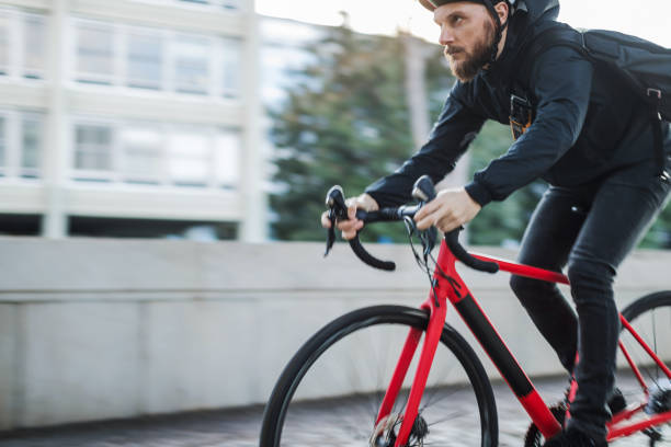 istock Bicycle messenger: commuter with road bicycle in the city 1253684868