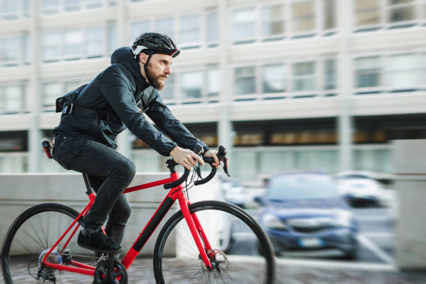 istock Bicycle messenger: commuter with road bicycle in the city 1253684878