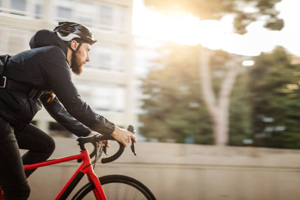istock Bicycle messenger: commuter with road bicycle in the city 1253684948
