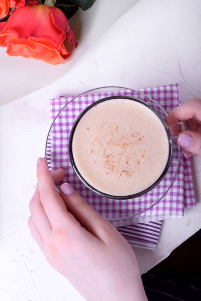 istock Coffee with foam and cinnamon and roses 1253685901