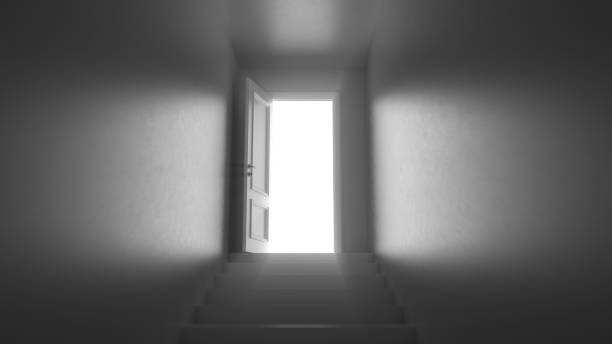 istock 3d render door with steps in a dark corridor 1253688147