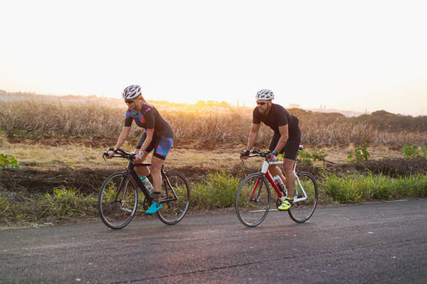istock Man and woman riding a bicycle 1253690587