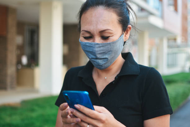 istock Woman with face protective mask 1253692523