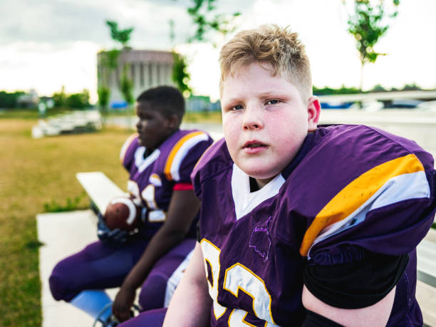 istock Junior Football players getting ready 1253693157