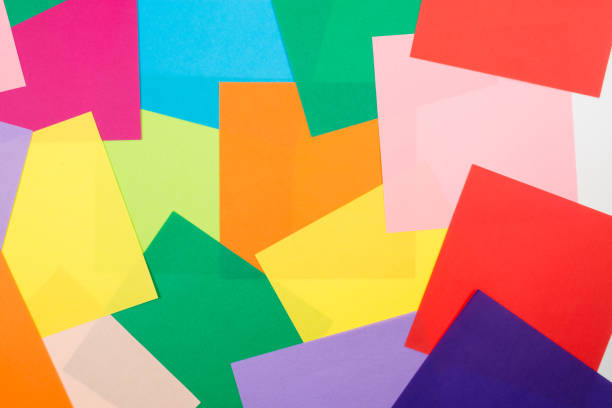 istock sheets of colored paper background. bright life 1253694151