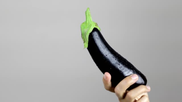 Woman holding eggplant
