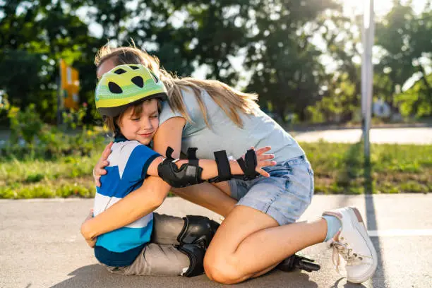 Photo of Little boy fell on the street