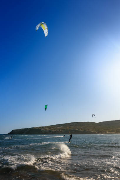 istock Prasonisi beach with kitesurfers surfing in waves (Rhodes, Greece) 1253698759