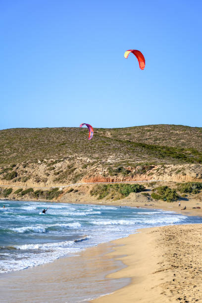 istock Prasonisi beach with kitesurfers surfing in waves (Rhodes, Greece) 1253698781