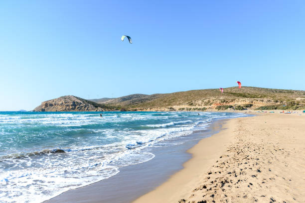 istock Prasonisi beach with kitesurfers surfing in waves (Rhodes, Greece) 1253698799