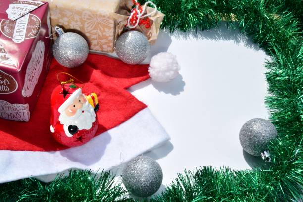 istock Modern Christmas composition. Christmas balls, green and silver decorations on a white background. Flat lay, top view, copy space. close up photo. can use for greeting card or christmas banner 1253698819