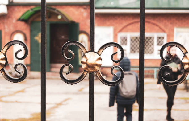 istock Metal fence is painted copper. 1253698935