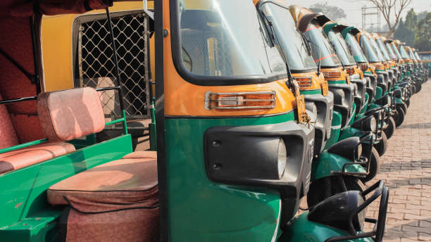 Indian taxi rickshaws exposed in a row