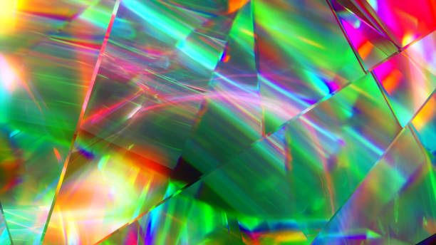 istock The light passes through the facets of a slowly rotating diamond and creates repetitive sparkling highlights and bright rainbow colors. Rainbow dispersion of light. 3d illustration 1253700461