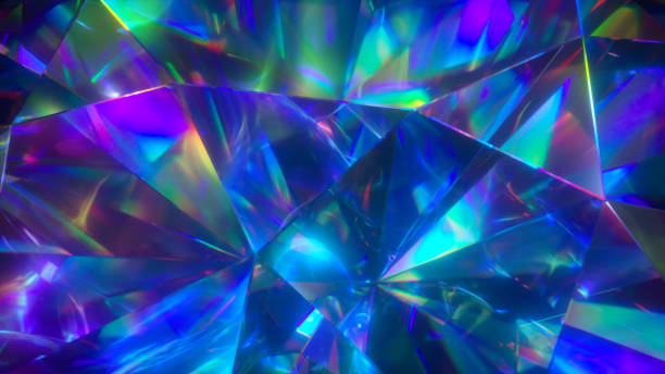istock The light passes through the facets of a slowly rotating diamond and creates repetitive sparkling highlights and bright rainbow colors. Rainbow dispersion of light. 3d illustration 1253700497