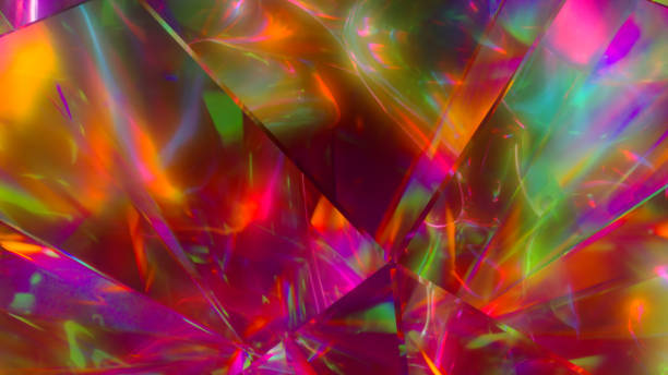 istock The light passes through the facets of a slowly rotating diamond and creates repetitive sparkling highlights and bright rainbow colors. Rainbow dispersion of light. 3d illustration 1253700498