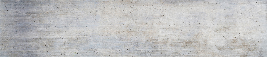 Panorama of a grungy concrete wall as background or texture