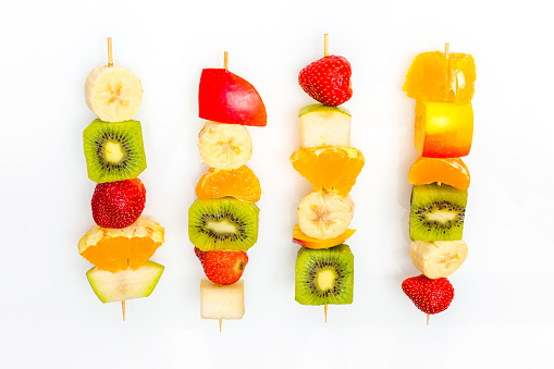 Tasty fruit skewers on the white background, Concept of healthy, fat free eating