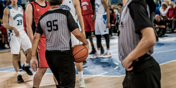 istock Referees standing on court 1253702509